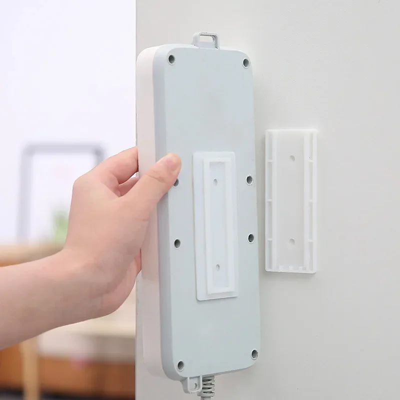 Selbstklebender Desktop-Sockel-Fixer Kabel Organizer Wandhanging Stromstreifenhalter Fixier-Plug-In entfernbare Wandmontierte Fixer