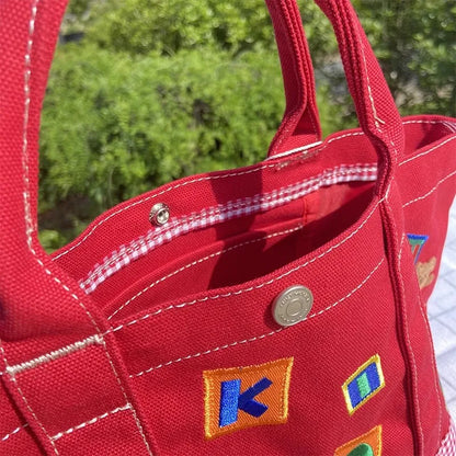 Handtasche – Karierter Bär aus Cartoon-Stickerei, leichte Canvas-Tasche mit großer Kapazität 342121 cm, Bento-Tasche